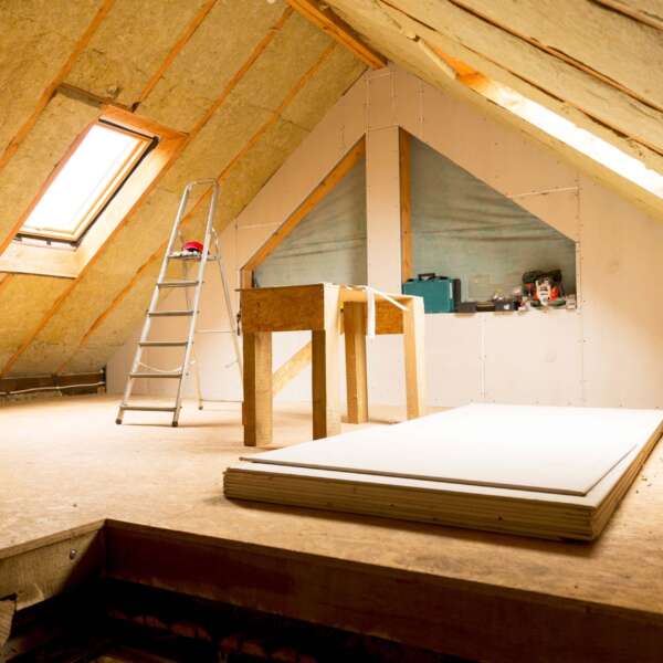house attic under construction mansard wall insulation with rock